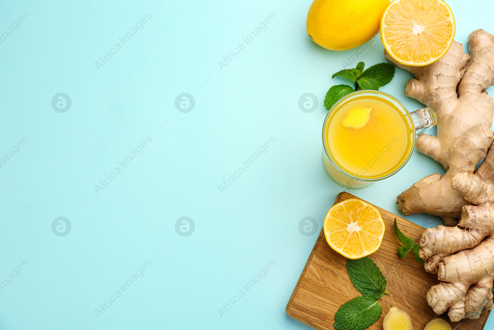Photo of Flat lay composition with immunity boosting drink on light blue background. Space for text