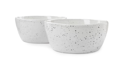 Beautiful empty ceramic bowls on white background