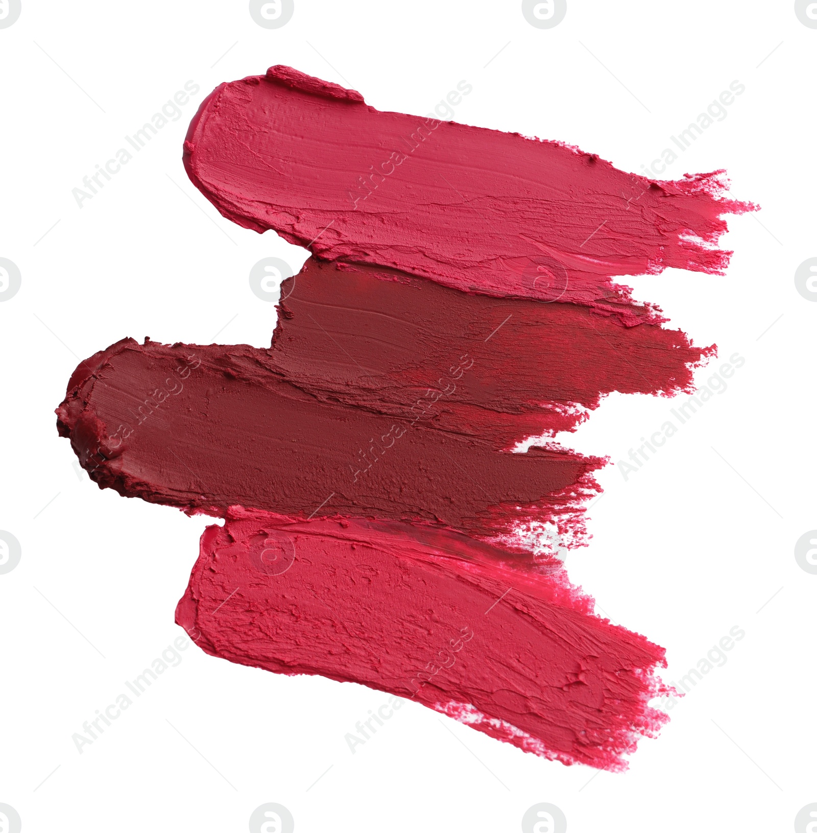 Photo of Smears of bright lipsticks on white background, top view