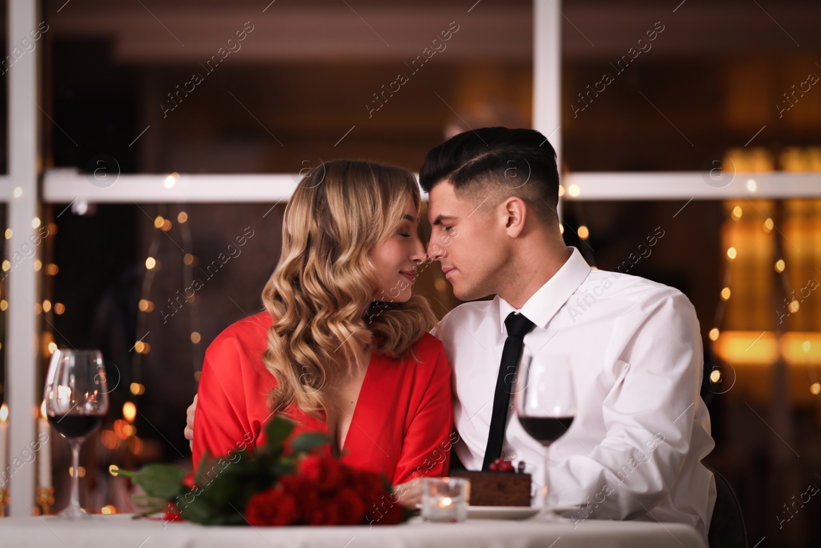 Photo of Lovely couple having romantic dinner on Valentine's day in restaurant