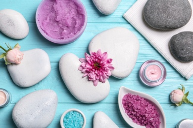 Photo of Flat lay composition with spa stones on wooden background