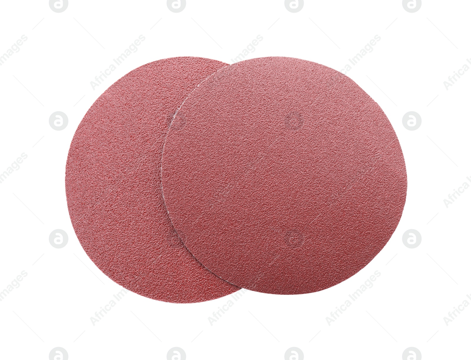 Photo of Two coarse sandpaper disks isolated on white, top view