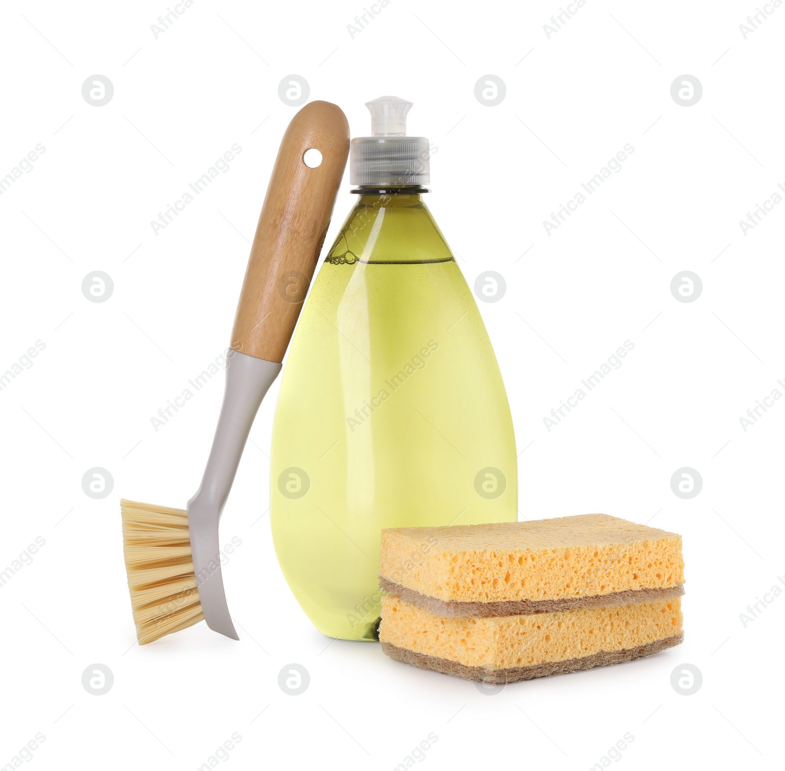 Photo of Bottle of cleaning product, brush and sponges isolated on white