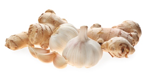 Ginger and fresh garlic on white background. Natural cold remedies