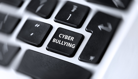 Image of Modern laptop keyboard with phrase CYBER BULLYING on black button, closeup 