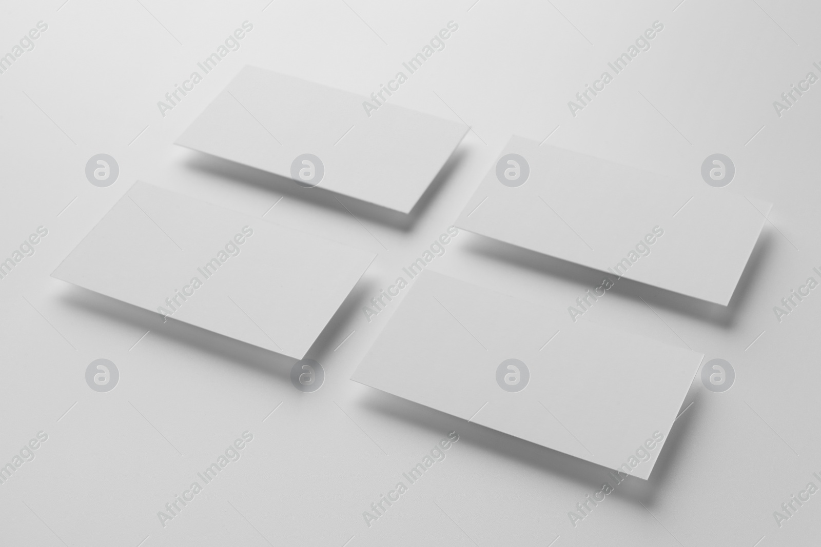 Photo of Blank business cards on white background. Mockup for design