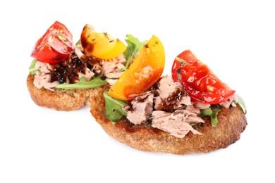 Photo of Delicious bruschettas with balsamic vinegar, tomatoes, arugula and tuna isolated on white