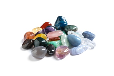 Photo of Pile of different beautiful gemstones on white background