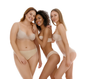 Photo of Group of women with different body types in underwear on white background