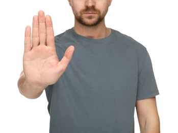 Photo of Man showing stop gesture isolated on white, closeup
