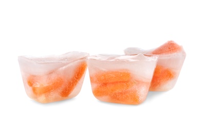 Photo of Fresh carrot in ice cubes on white background. Frozen vegetables