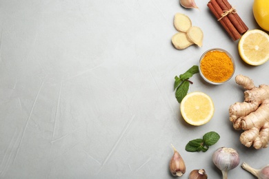 Flat lay composition with fresh products on grey table, space for text. Natural antibiotics