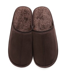 Pair of brown slippers on white background, top view
