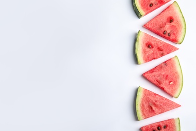 Photo of Slices of ripe watermelon on white background, flat lay. Space for text