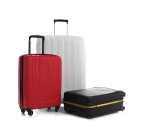 Modern suitcases for travelling on white background