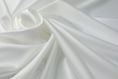 Photo of Texture of crumpled white silk fabric as background, closeup