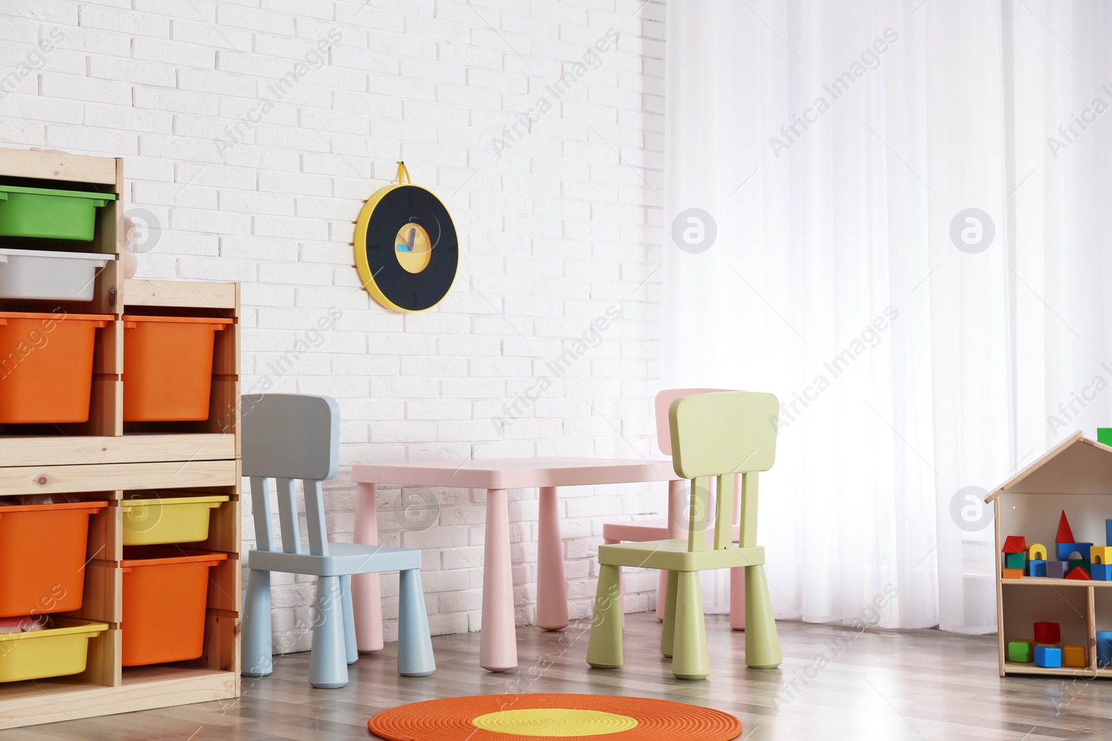 Photo of Modern child room interior with table and chairs