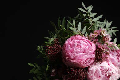 Photo of Bouquet of beautiful flowers on black background, space for text