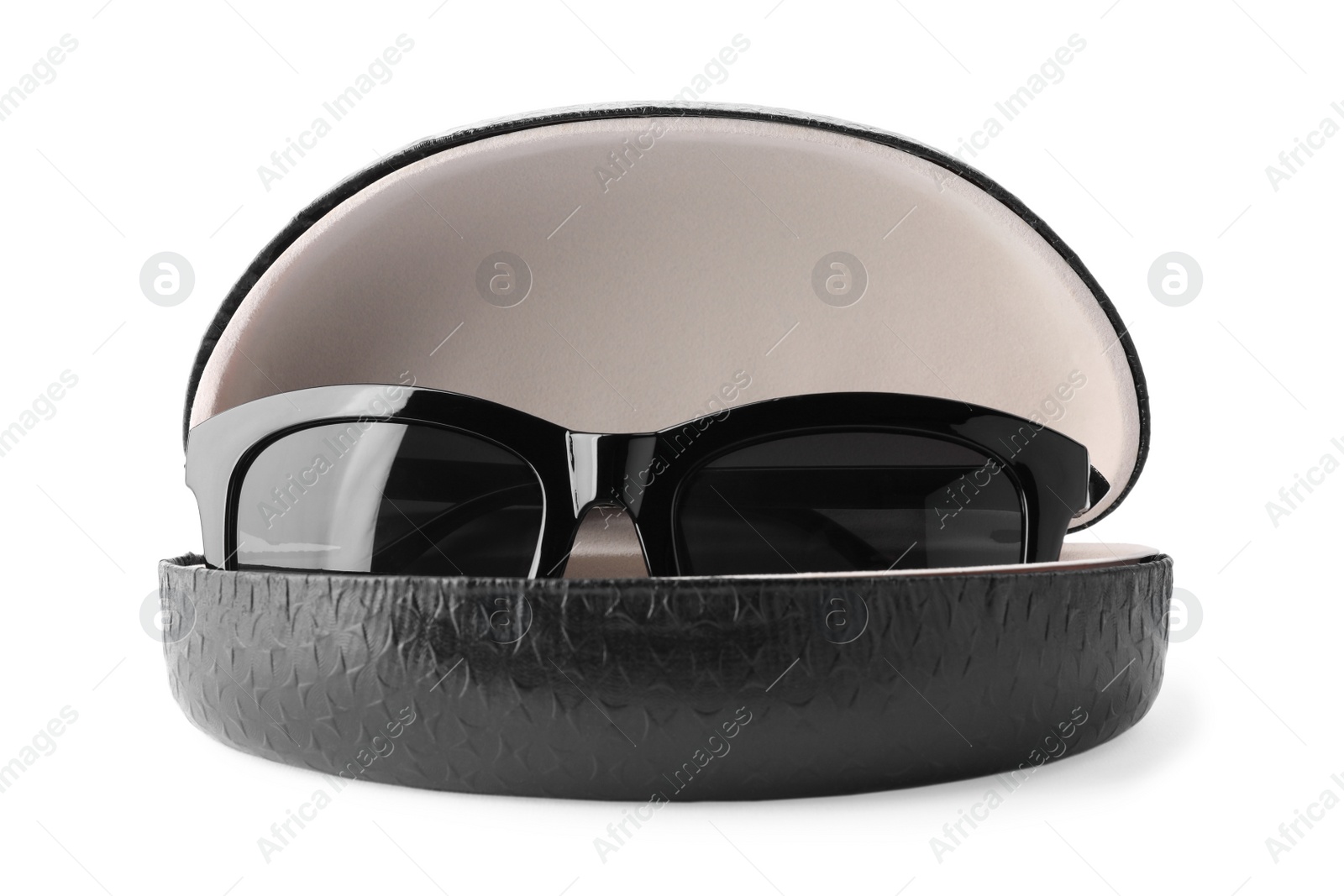 Photo of Stylish sunglasses in black leather case on white background