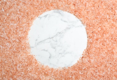 Photo of Frame of pink himalayan salt on white marble table, flat lay. Space for text
