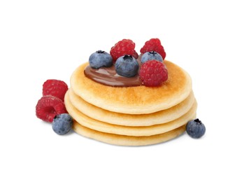 Stack of tasty pancakes with chocolate spread and berries isolated on white