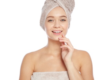 Portrait of young pretty woman with towels on white background