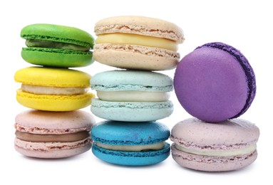 Photo of Different delicious colorful macarons on white background