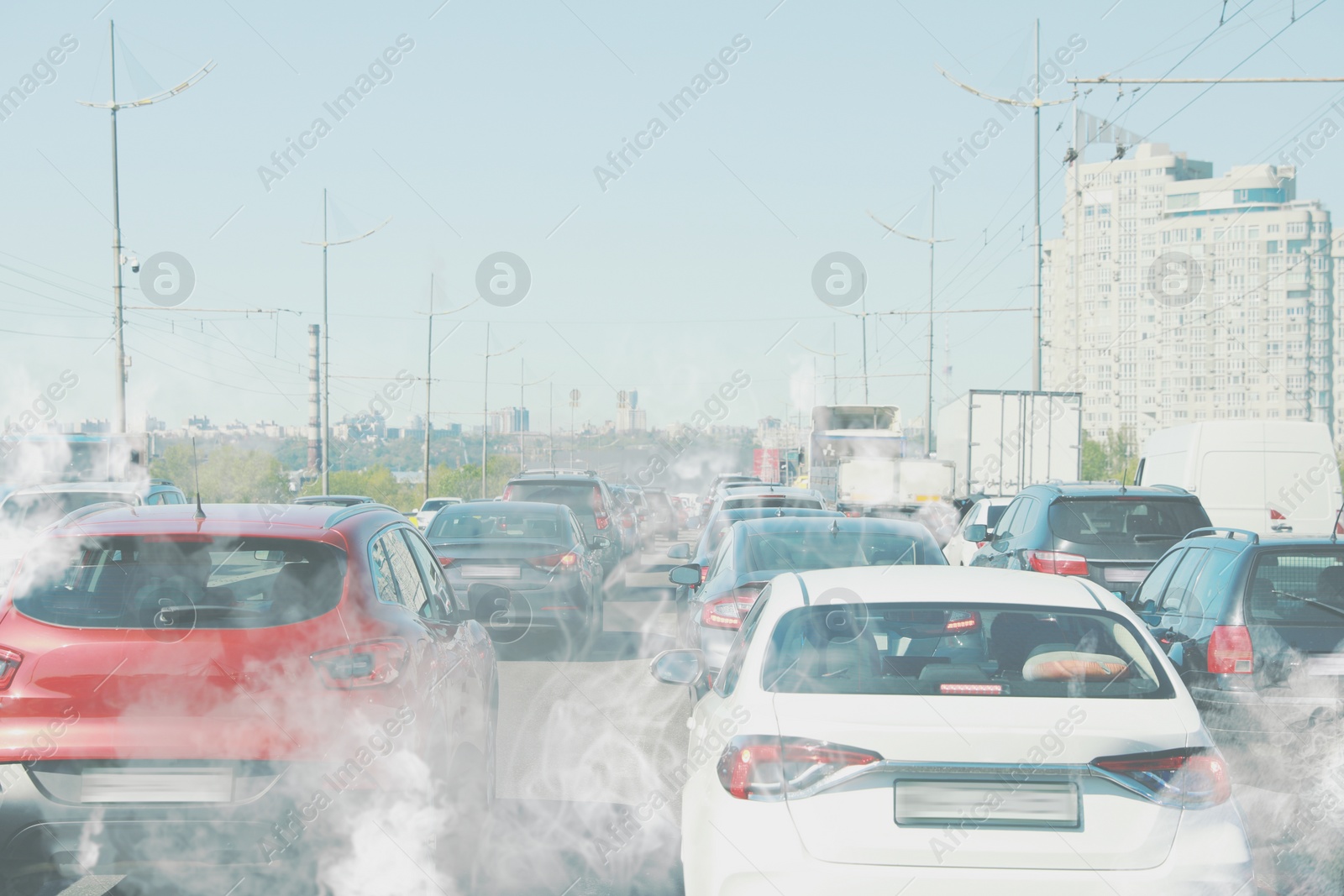 Image of Environmental pollution. Air contaminated with fumes in city. Cars surrounded by exhaust on road