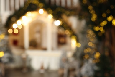 Blurred view of stylish room interior with Christmas tree and festive decor