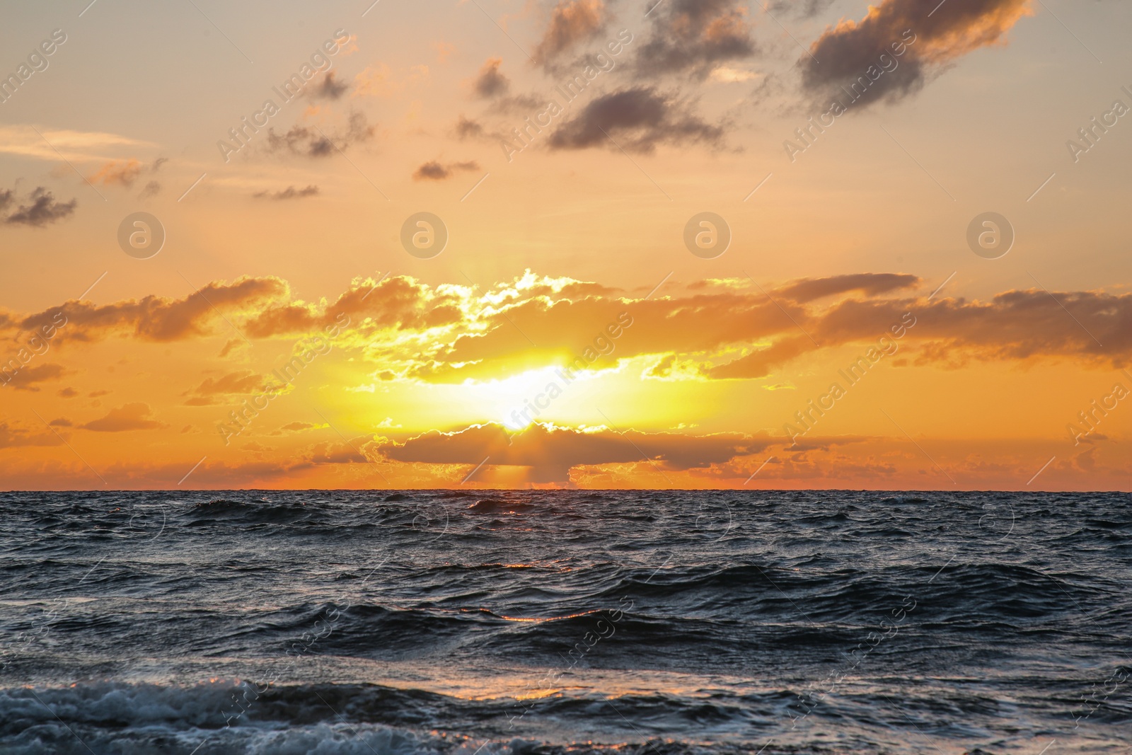 Photo of Picturesque view of sea under sky at beautiful sunset