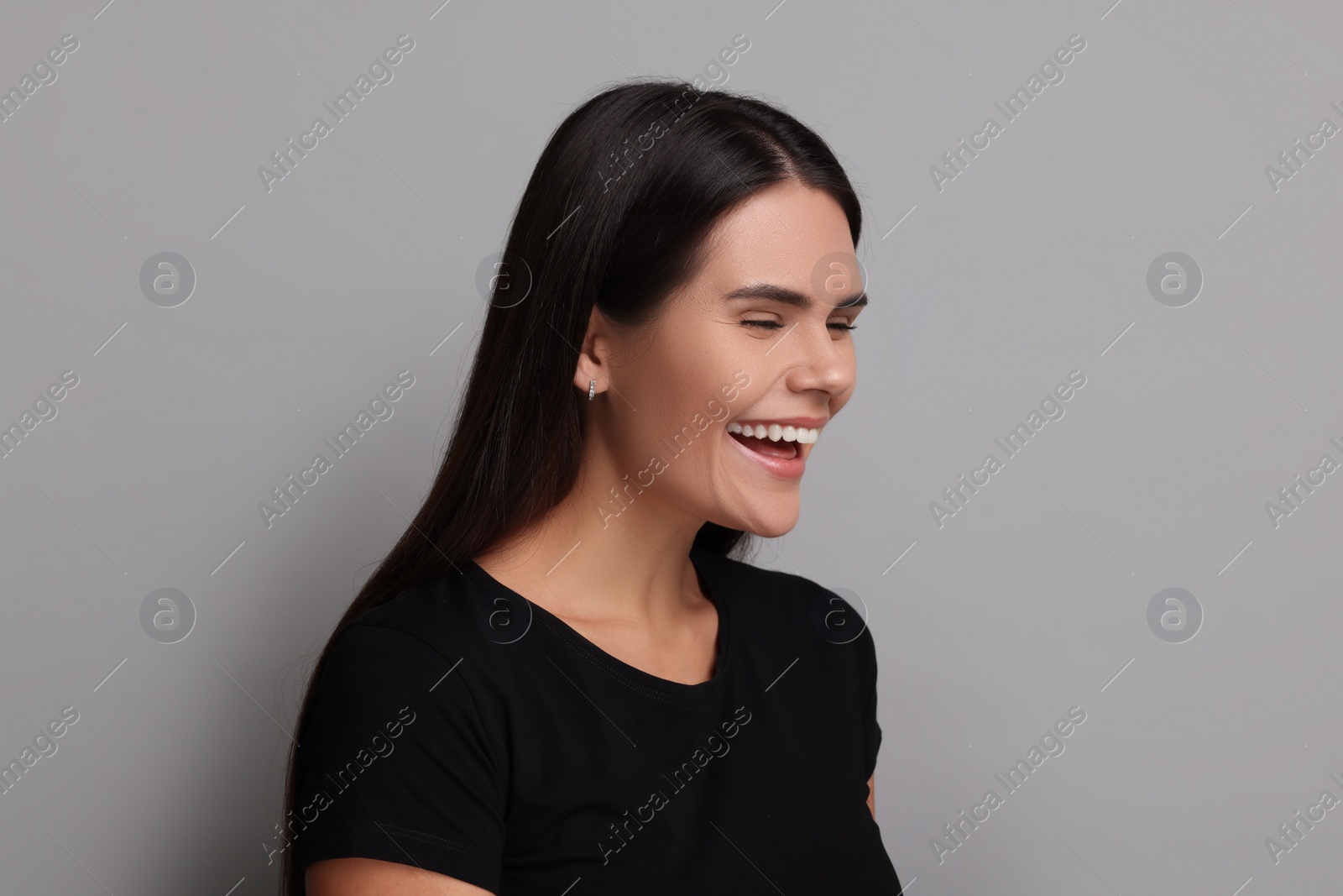 Photo of Personality concept. Emotional woman on grey background