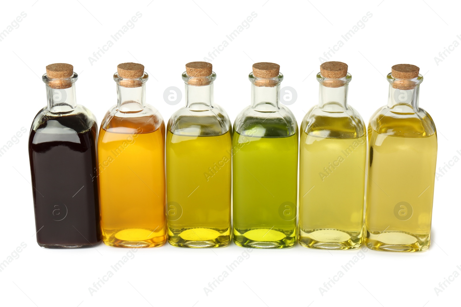 Photo of Vegetable fats. Bottles of different cooking oils isolated on white