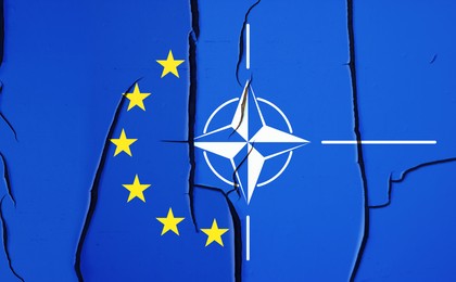 Image of Flags of European Union and NATO on broken wall, banner design