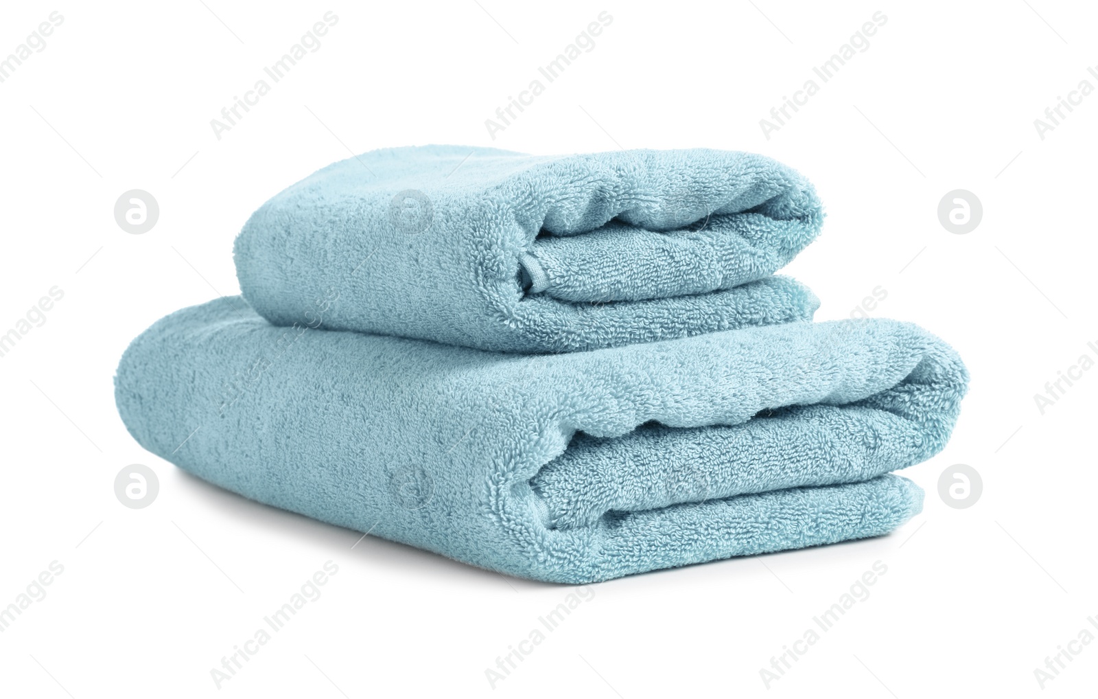 Photo of Folded clean soft towels on white background