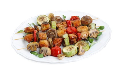 Photo of Delicious shish kebabs with vegetables and microgreens isolated on white