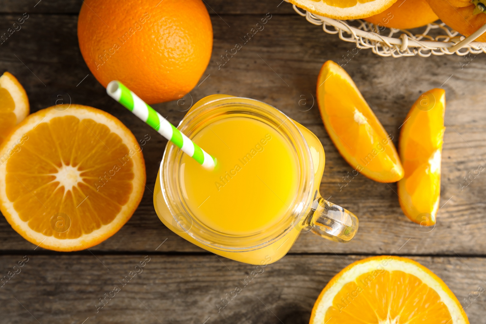 Photo of Flat lay composition with orange juice and fresh fruit on wooden background