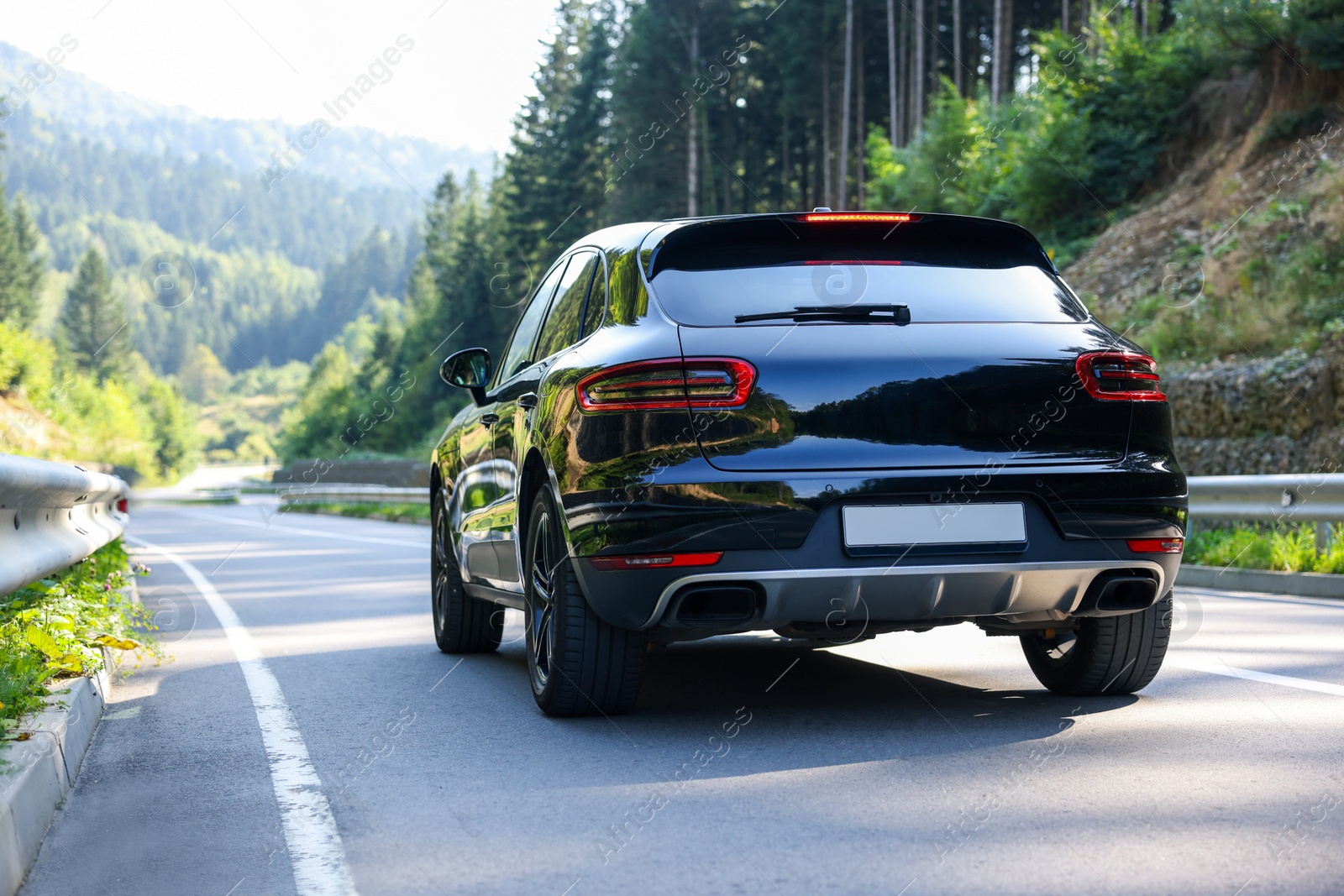 Photo of Picturesque view of asphalt road with cars