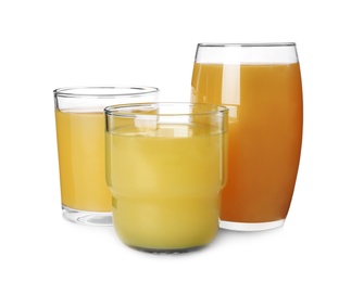 Glasses of delicious juice isolated on white