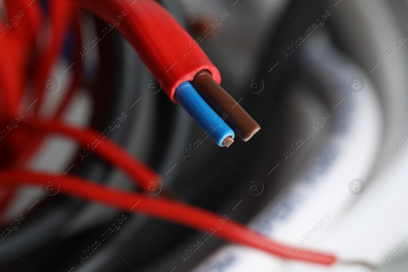 Photo of Colorful electrical wire on blurred background, closeup