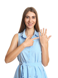 Happy young woman wearing beautiful engagement ring on white background