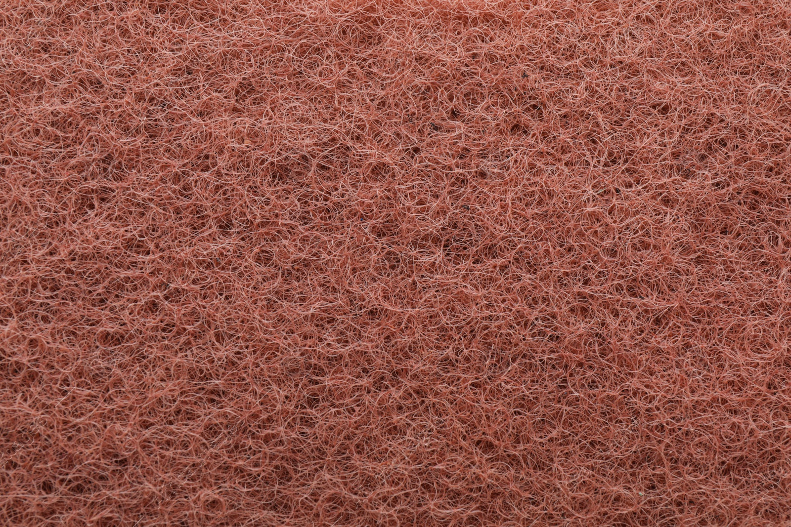 Photo of Brown abrasive cleaning sponge as background, top view