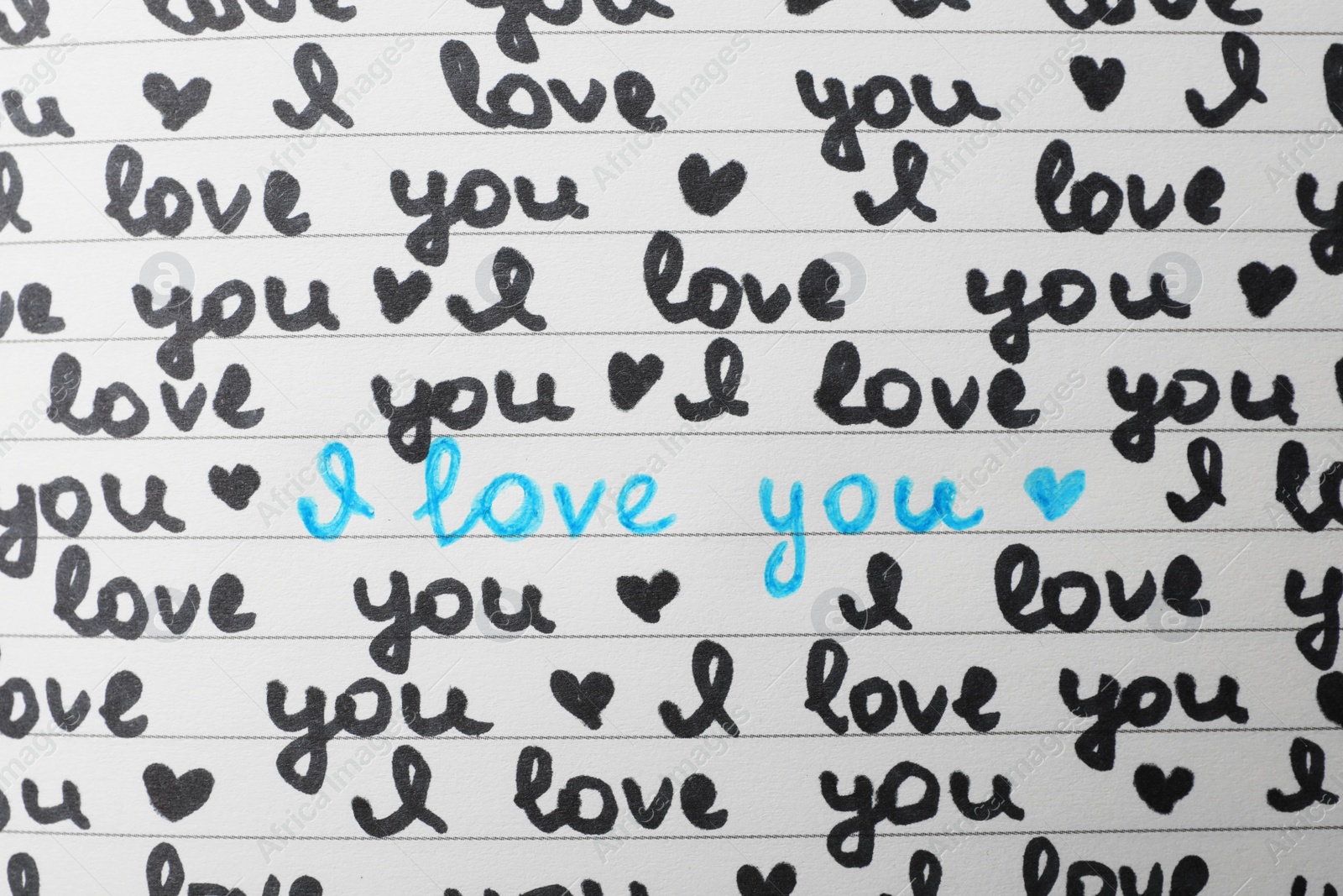 Photo of Notebook page with words I LOVE YOU and hearts as background, top view