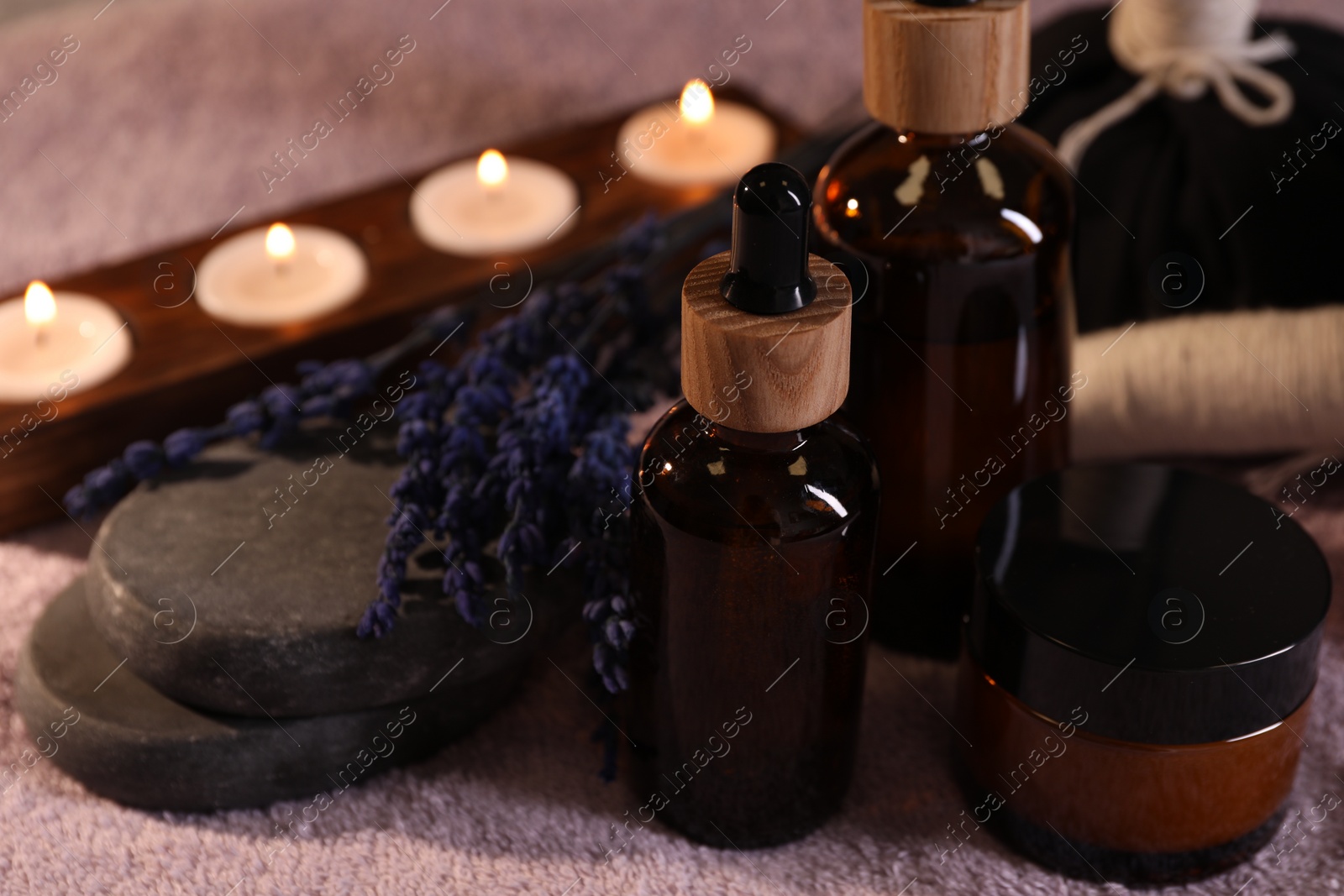 Photo of Composition with spa products and dry lavender flowers on soft light surface