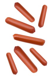 Image of Fresh raw sausages flying on white background