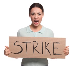 Angry young woman holding cardboard banner with word Strike on white background