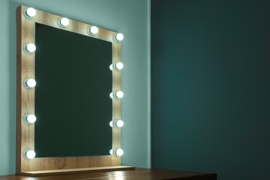 Photo of Beautiful mirror in modern makeup room