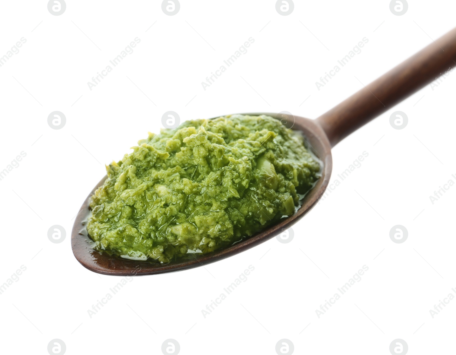 Photo of Spoon of tasty pesto sauce isolated on white