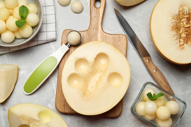 Flat lay composition with melon balls on grey table