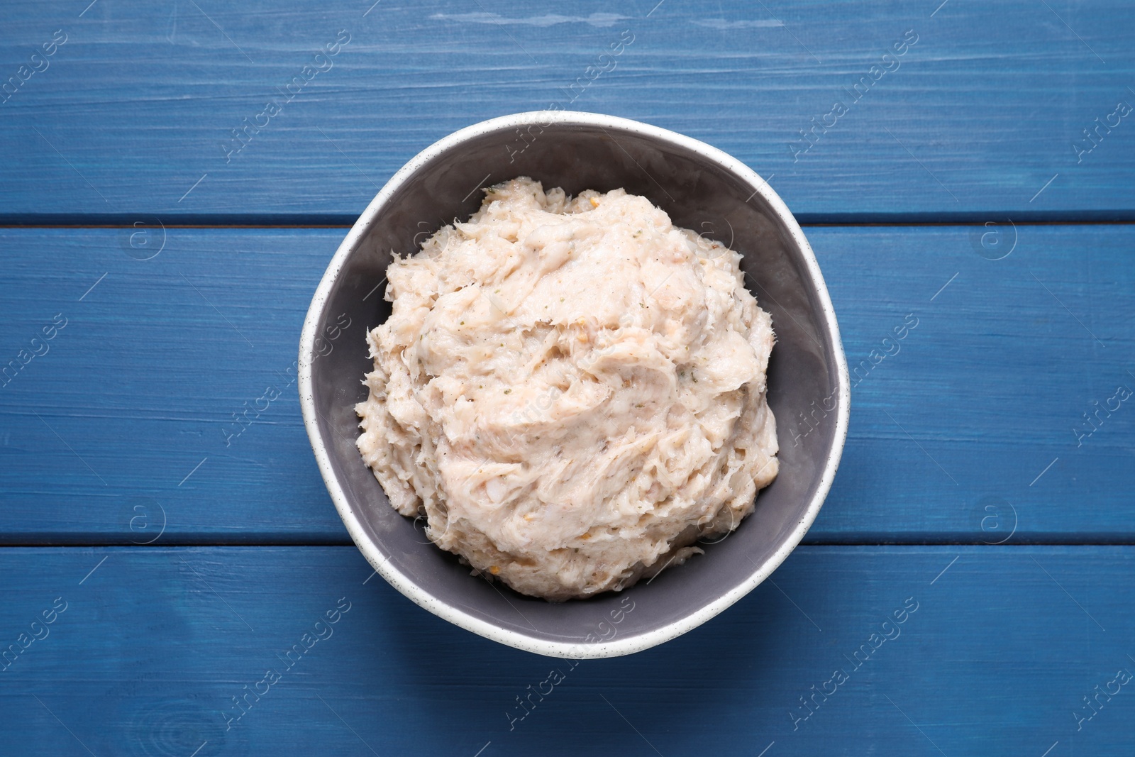 Photo of Delicious lard spread on blue wooden table, top view