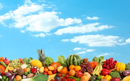 Assortment of fresh organic fruits and vegetables outdoors 